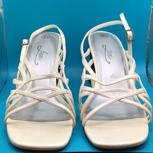 Fioni, crème pearly color strappy heels.